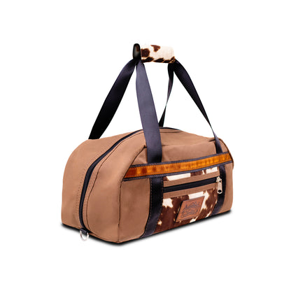 Antelope Brown Overnight Canvas Bag with limited edition cow print fabric side view.